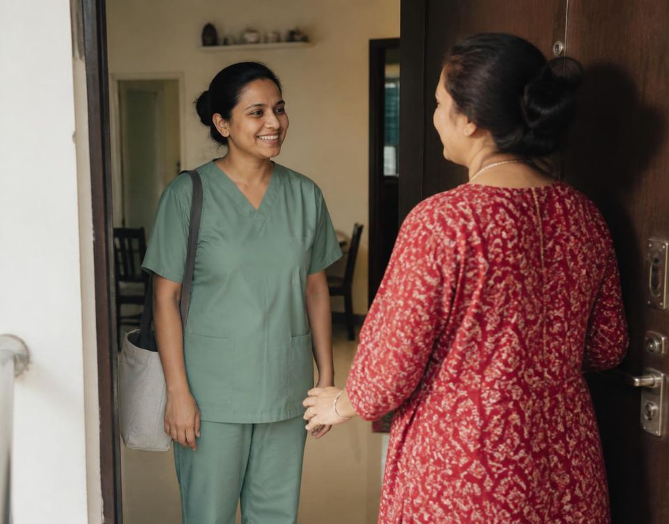 A home nurse greeting a family at their front door